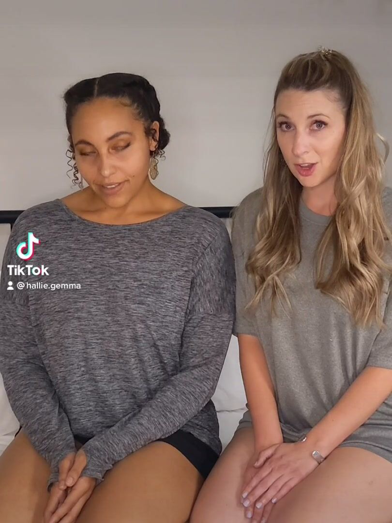 Two beautiful women kiss