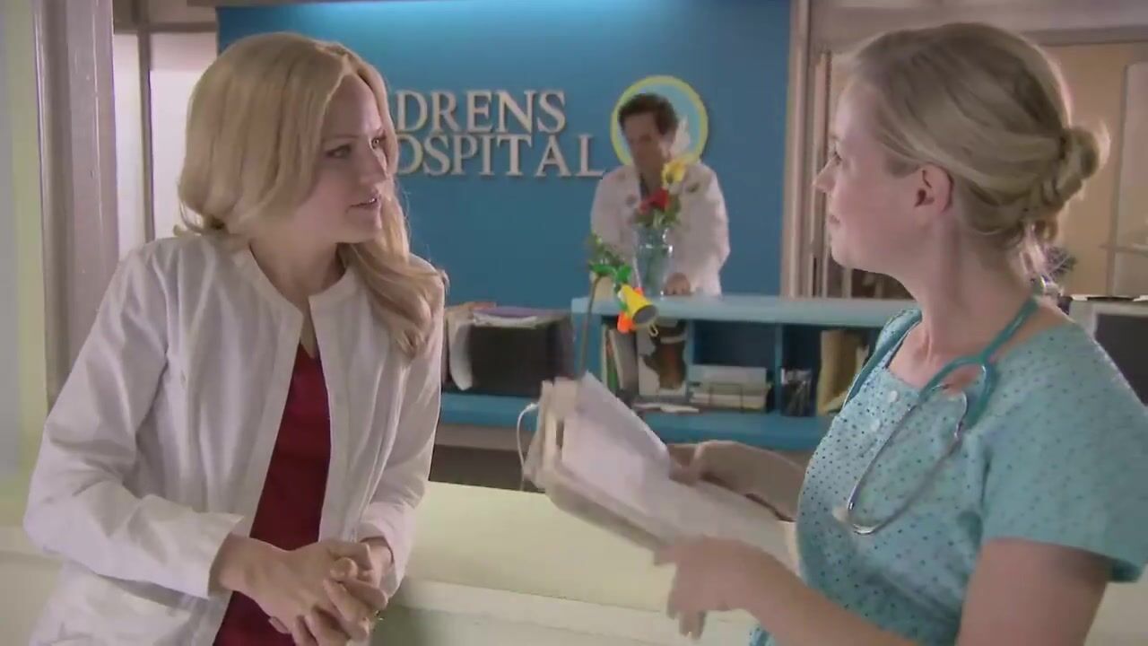 Malin Akerman kiss with Zandy Hartig in 'Childrens Hospital'