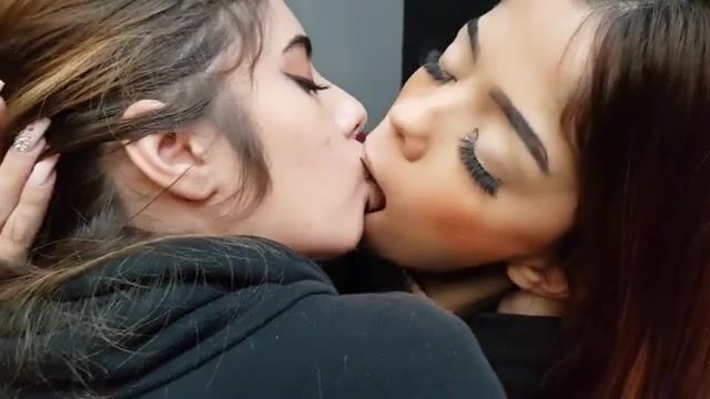 Beautiful young Brazilian babes in passionate deep kissing